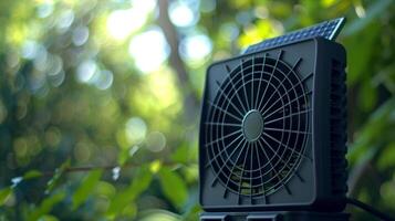 Closeup of a compact solar powered fan with a builtin solar panel on top photo