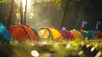 A fuzzy view of campers setting up their colorful tents in the morning light photo