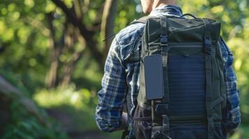 A solarpowered backpack with multiple compartments and a builtin USB charging port for your devices photo