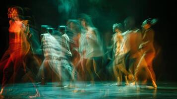 Blurry forms sway to the rhythm of the performance lost in the moment photo