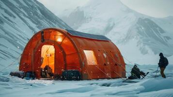 An emergency shelter in a snowy environment equipped with solar panels to keep the inhabitants warm and connected photo