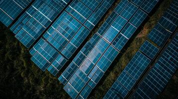 A closeup of the solar panels each piecemeal attached to a grid creating a beautiful pattern of blue and black photo