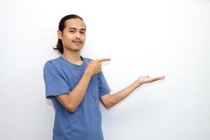 Asian man smiling with both hands pointing to the side. isolated on white background photo