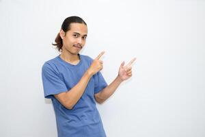 Asian man smiling with both hands pointing to the side. isolated on white background photo