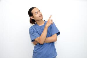 Asian man smiling with both hands pointing to the side. isolated on white background photo