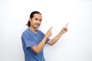 Asian man smiling with both hands pointing to the side. isolated on white background photo
