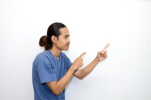 Asian man smiling with both hands pointing to the side. isolated on white background photo