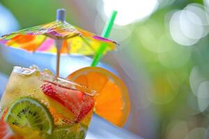 Vibrant Tropical Cocktail with Colorful Fruit Garnish photo