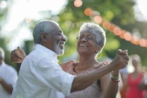 A Senior Man and Woman Dancing Energetically at an Outdoor Event photo