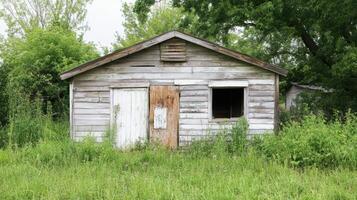 Aging wooden building set for demolition, showing signs of wear. photo
