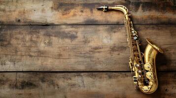 Antique saxophone on a classic old wooden surface. photo