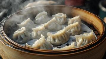Bamboo Basket Filled with Steaming Chinese Dumplings photo