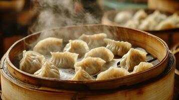 Steaming Chinese Dumplings in a Bamboo Steamer Basket photo