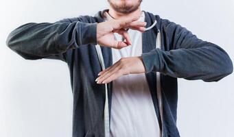 Male interpreter talking in sign language. People talking in sign language isolated. Unrecognizable man gesturing in sign language photo