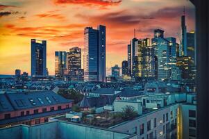 Frankfurt Skyline at Sunset, Modern Skyscrapers Illuminated Against a Vibrant Sky photo