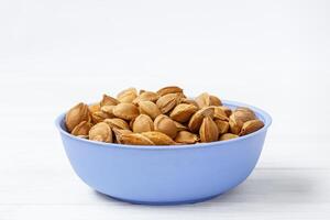 Apricot pits. Inside each apricot stone is a small treasure in the form of kernels. They are rich in minerals, proteins and contain a substance called amygdalin. photo