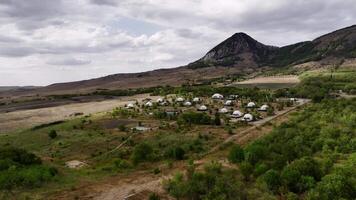 Glamping with a pool on a green hill. Aerial view from a drone. A secluded place far from the city, noise and dust. Luxury rest video