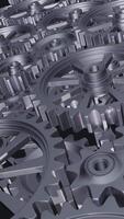 A close-up perspective showcases a series of rotating interlocking metal gears, highlighting the precise engineering and the complexity of mechanical design in machinery. vertical footage video