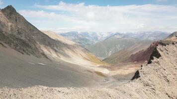 Aerial view caucasus mountains range with colorful valleys on alpine zone. Kazbek mountain peak in background video