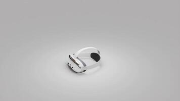 A 360-degree view of a white VR headset on a gray background. The sleek design, curved edges, and adjustable straps are clearly visible, showcasing modern virtual reality technology video