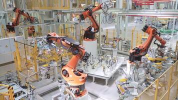 Moscow - Russia, 05.05.2022. robotic arms working at the modern factory. Scene. View inside of a workshop with the machinery, industrial background, timelapse effect. video