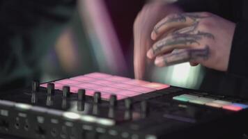 Click colored squares on mixer panel. ART. Hands in dark room are dialing code from multi-colored squares. Abstract music on mixer color board video