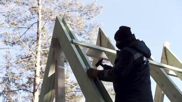 Work on the construction of a house. Clip . Complex construction with a screwdriver putting insulation in home. video