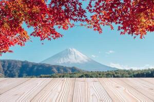 Empty wood table mockup with Mount Fuji view at Saiko lake background and copy space for text, Mock up for your product display and montage in autumn season. Japan travel and vacation concept photo