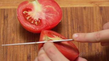 Cutting a Tomato on a Wooden Board video