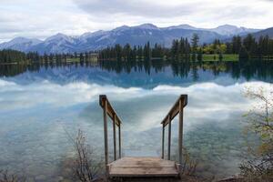 Stairs to the sparkling clear blue waters of Beauvert Lake near Jasper photo