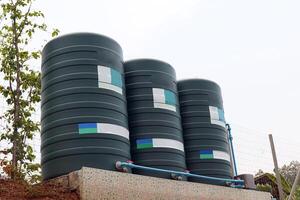 water tank installed outside the building. For use as a reserve of water for use in homes and offices. Made of special grade material, extra thick, UV protection and not moss. photo