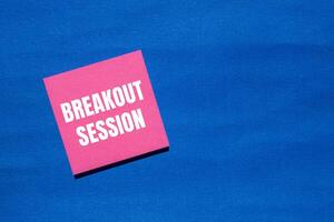 Breakout session message written on pink paper with blue background. Conceptual breakout session symbol. Copy space. photo