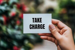 Take charge message written on white card Conceptual take charge symbol. Copy space. photo