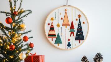 Festive Christmas Wall Art with Embroidered Trees and Decorated Christmas Tree in Cozy Home Setting photo