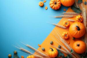 Autumn Harvest Background with Pumpkins, Wheat, and Leaves on Vibrant Blue and Orange Surface photo