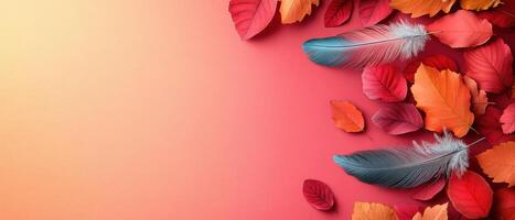 Vibrant Autumn Leaves and Feathers on Gradient Background with Warm Tones photo