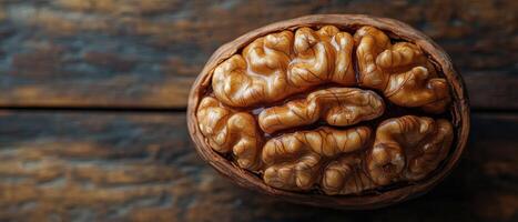 Close-Up of a Walnut on Rustic Wooden Background Highlighting Detailed Texture and Natural Patterns photo
