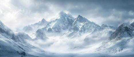Majestic Snow-Covered Mountain Range Under Cloudy Sky in Winter Wonderland photo