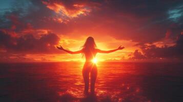 Woman Embracing Sunset in Ocean, Silhouette Against Vibrant Sky, Peaceful and Serene Moment Captured in Nature photo