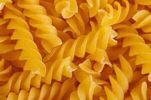 Pasta products in the form of a spiral, texture photo