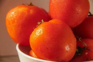 Fresh red tomatoes, the red color indicates that the tomato is ripe photo