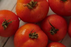 Fresh red tomatoes, the red color indicates that the tomato is ripe photo
