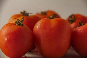 Fresh red tomatoes, the red color indicates that the tomato is ripe photo