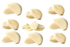 Side view set of fresh peeled white garlic cloves with slices in stack isolated on white background with clipping path photo