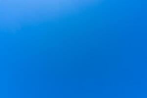 Beautiful blue sky without clouds in the morning or evening used as natural background texture in decorative art work photo