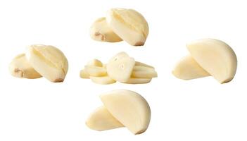 Side view set of fresh peeled white garlic cloves with slices in stack isolated on white background with clipping path photo