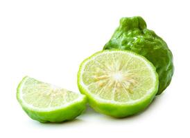 Fresh green kaffir lime fruit or bergamot with half and slice or piece isolated on white background with clipping path photo