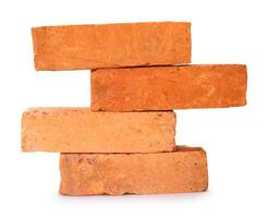 Side view of old orange or red bricks in stack isolated on white background with clipping path photo