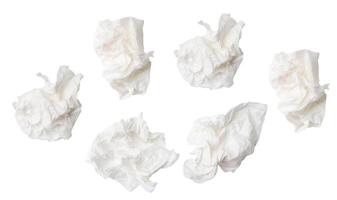 Top view set of white screwed or crumpled tissue paper balls after use isolated on white background with clipping path photo