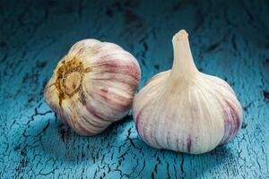 Garlic bulb on wooden background photo